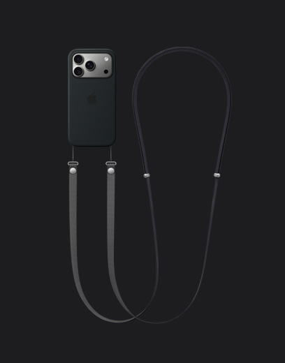 جهاز iPhone 17 Pro، الجزء الخلفي الخارجي، لون فضي، وحافظة سيليكون بلون أسود مع MagSafe وحزام كتف مثبّت بلون رمادي غامق